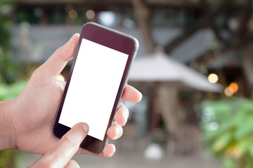 Woman hand holding smart phone with cafe background