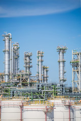 Fototapeta premium Petroleum and refinery industrial plant with blue sky