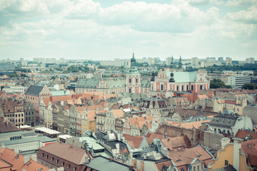 Poznan, Poland - June 28, 2016: Vintage photo, View on buildings and collegiate church in polish town Poznan
