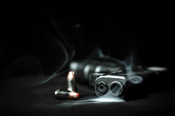 Smoking gun and bullets