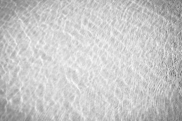 Light swimming pool rippled water texture reflection with black and white