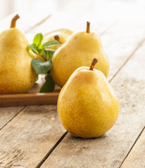 Fruit background. Fresh organic pears on old wood. Pear autumn harvest