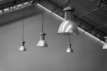 Big lamp silver on ceiling factory, black and white tone