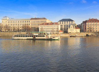 Fototapeta na wymiar Prague in the winter colors Czech, river side ship