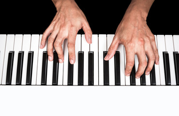 Naklejka premium professional asian musician hands playing white piano, isolated on black
