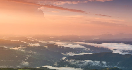 Fototapeta na wymiar Mountain panorama during sundown. Beautiful natural panoramic landscape in the summer time