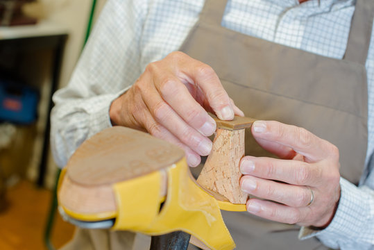 Cobbler working on a shoe heel
