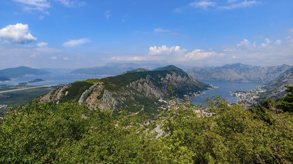 Panorama of the Kotor Bay from a mountain on a sunny day with a