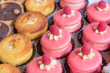 Large strawberry macarons at Borough Market in London, UK