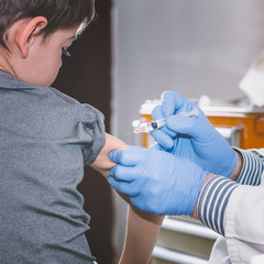 Obraz premium Child vaccine. Little boy getting a vaccine shot