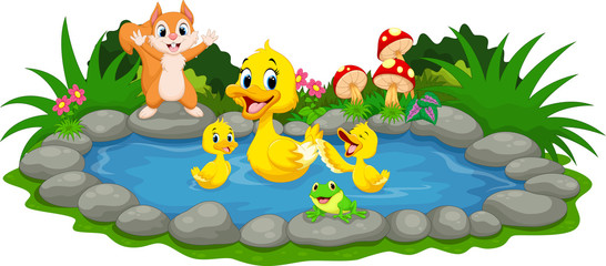 Mother duck and little ducklings swimming in the pond