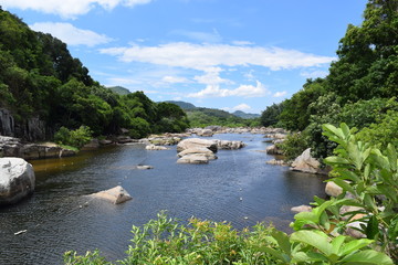 Fototapeta na wymiar fresh Ham Ho stream with rock reflect on water surface in Binh Dinh province, vietnam