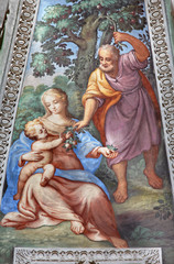 Fototapeta na wymiar BRESCIA, ITALY - MAY 22, 2016: The Fresco of Holy Family in apse of St. Joseph chapel in church Chiesa di San Francesco d'Assisi by unknown artist of 16. cent.