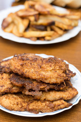 Breaded steaks served with fried potatoes