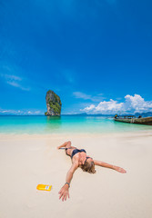 Cute woman relaxing on the beach
