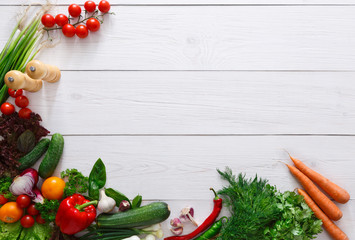 Fresh vegetables frame on white wooden background with copy space