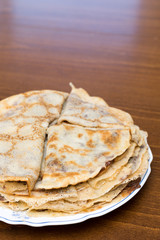 Fried pancakes with chocolate cream served on the plate