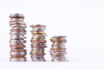 growing money graph on a row of coin and pile of bath coins stack  on white background finance business isolated
