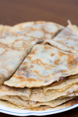 Fried pancakes with chocolate cream served on the plate