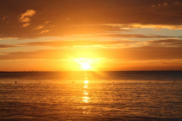 Fototapeta na wymiar Orange sunset over the sea.
