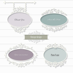 Vintage filigree oval frames and signboard.