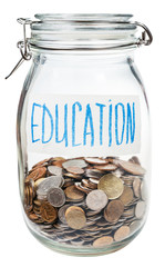 saved coins for education in closed glass jar