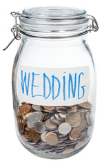 saved coins for wedding in closed glass jar