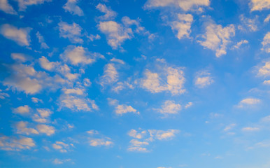 Pretty fluffy orange clouds in a sunset sky
