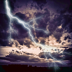 Fototapeta na wymiar Night cityscape with strong lightning