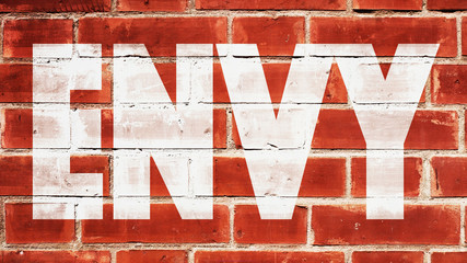 Envy Written On A Brick Wall