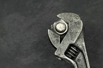 Old monkey wrench, bolt and nut 