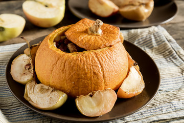Whole baked pumpkin on plate