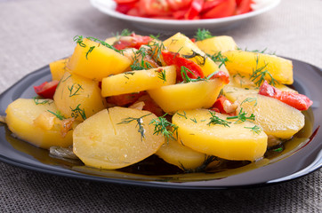 Close Up view on stew of potatoes with onion, bell pepper and fe