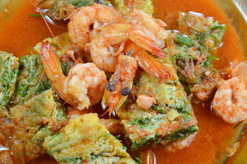 fried egg stuffed climbing wattle and shrimp in spicy sour soup on dish