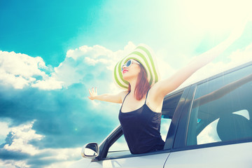 Relaxed happy woman traveling in car