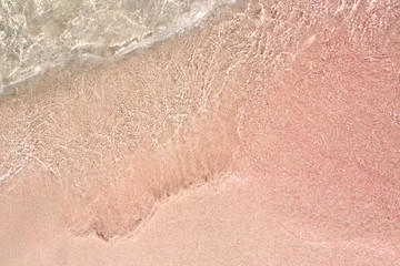 background of pink sand on the beach