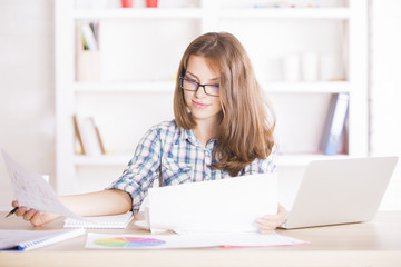 Businesswoman doing paperwork