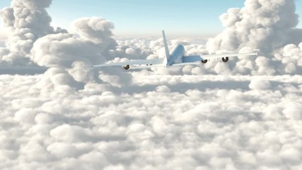 A passenger plane flying above the clouds