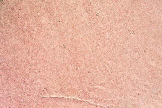Background Of Pink Sand On The Beach