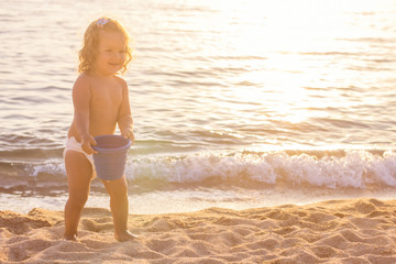 Little Girl Playing On The Beach