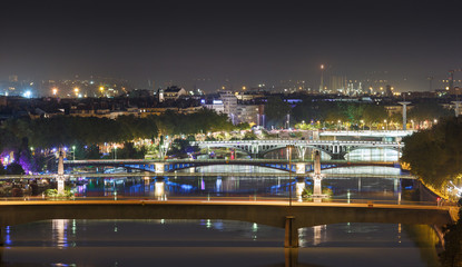 Fototapeta na wymiar Bridges over the Rhone river in Lyon at a warm, summer night.