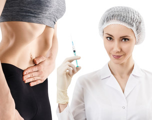 Female doctor with syringe and patient belly