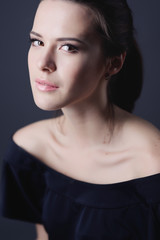 Fototapeta premium Face of beautiful young woman with brown make-up and straight hair