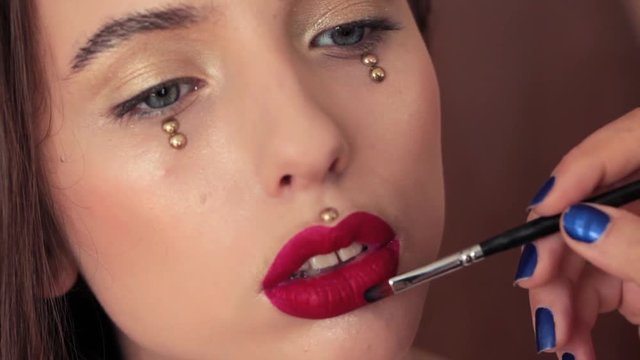 Beautiful young girl makeup lipstick