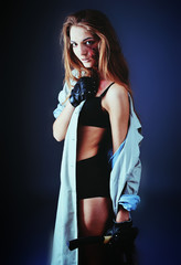 zombie girl with an ax. scars on the body with blood.