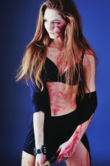 zombie girl with an ax. scars on the body with blood.