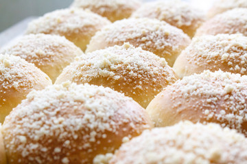 fresh hot sweet baked buns, close-up photo.