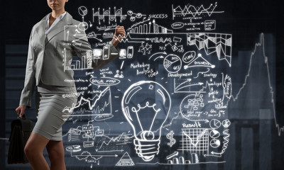 Woman sketching business ideas 