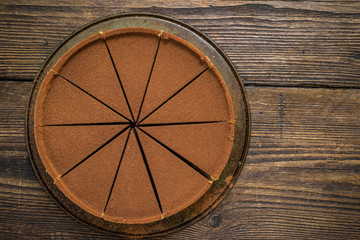 Fototapeta na wymiar chocolate cake on wooden table