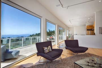 Fototapeta premium Modern living room with amazing view and large windows.